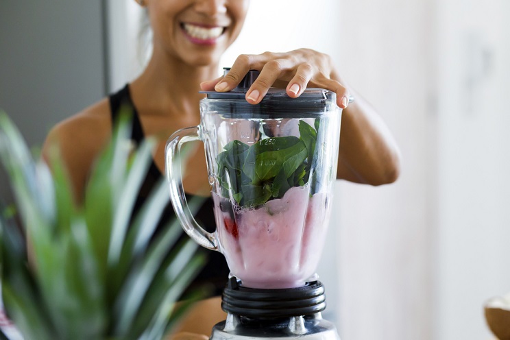 woman making real food smoothie