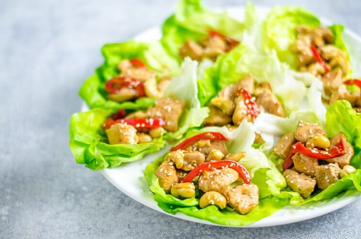 A healthy version of a Chinese takeout classic, these savory cashew chicken lettuce tacos make your slow cooker do all the work!