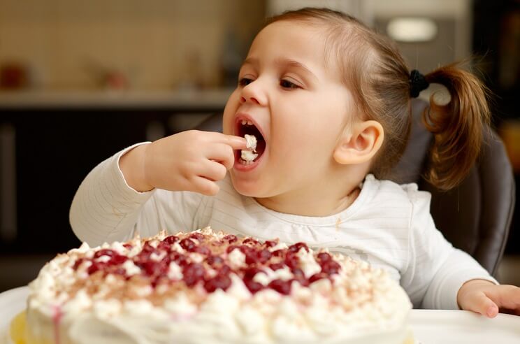 kid eating cake