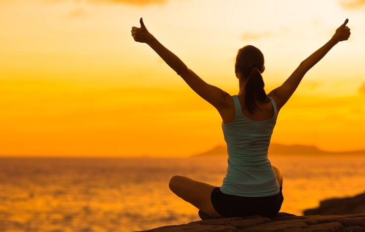 woman watching sunset