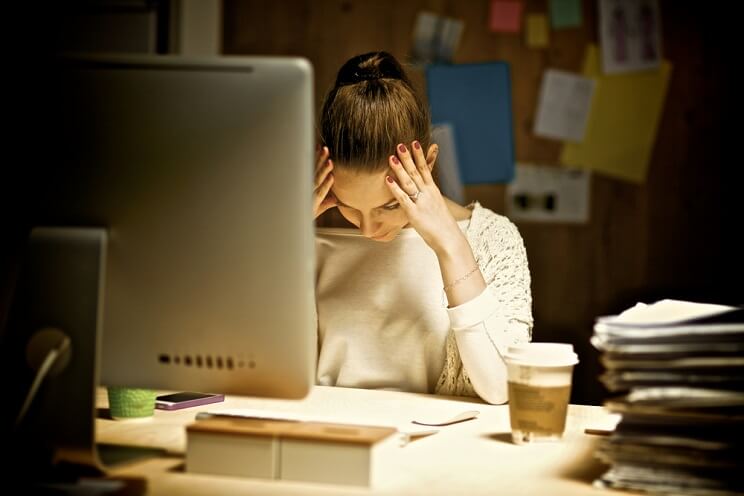 tired woman at desk