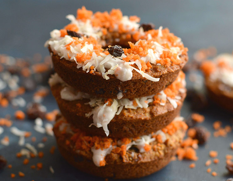 Got a donut craving? Bite into these Paleo Carrot Cake Donuts with a decadent coconut cream frosting! Grain-free, full of protein and healthy fat.