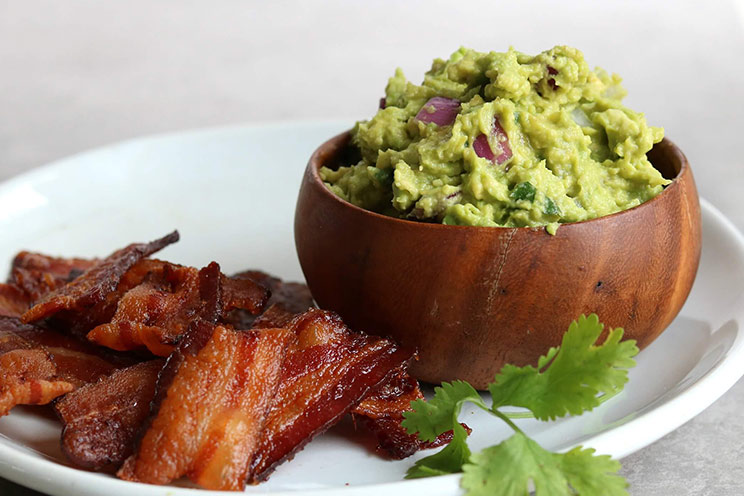 Swap tortilla chips for crisp bacon chips and dip in rich guacamole! It’s the perfect recipe for game-day entertaining or as a movie-watching munchie.