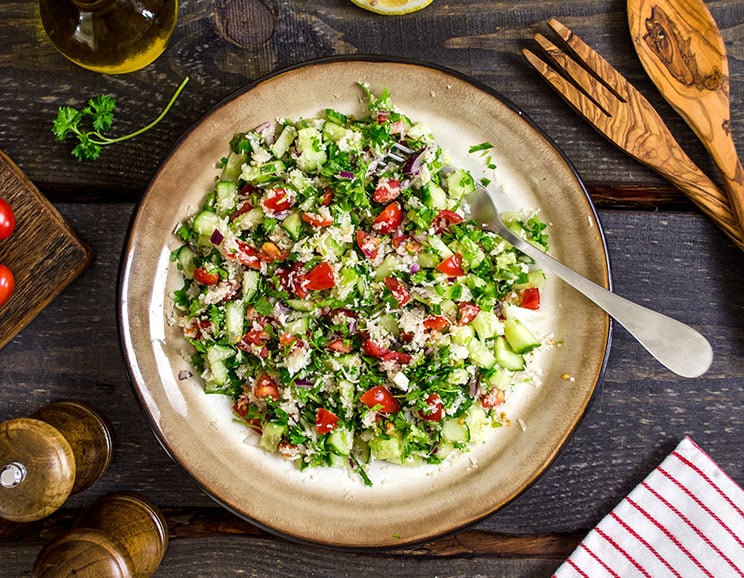 Juicy tomatoes, cucumbers, red onion, mint and parsley come together in this fresh salad tossed in extra virgin olive oil and lemon.