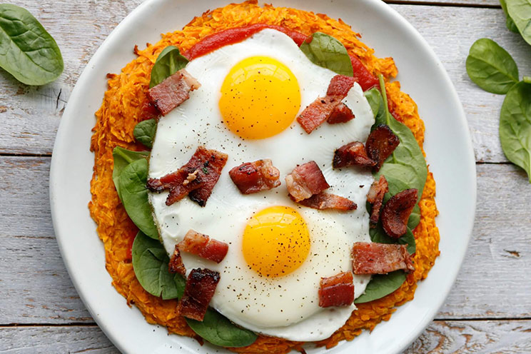 Enjoy pizza for breakfast with this egg, spinach and bacon pie served on a sweet potato crust.