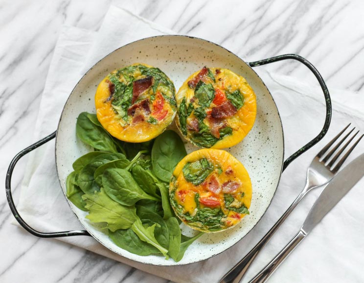 These individual-sized egg muffins are chock full of bacon and spinach for a satisfying, portable breakfast.