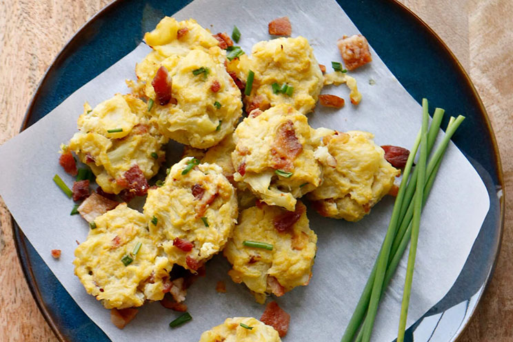 Mashed cauliflower stands in for the potatoes in this bacon-loaded munchie! Serve your cauliflower bites hot with Paleo sour cream for full-on goodness.