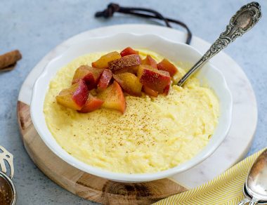 Creamy, dairy-free coconut custard is topped with warm stewed apple slices for a light and healthy dessert.