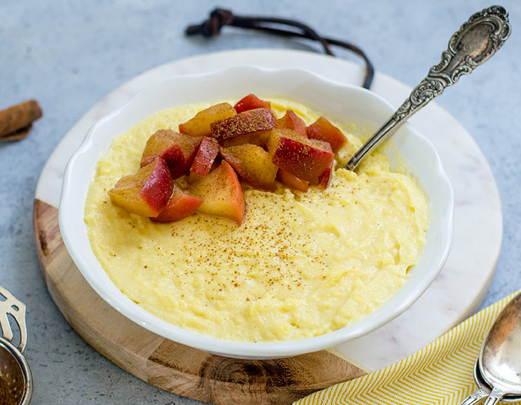 Creamy, dairy-free coconut custard is topped with warm stewed apple slices for a light and healthy dessert.