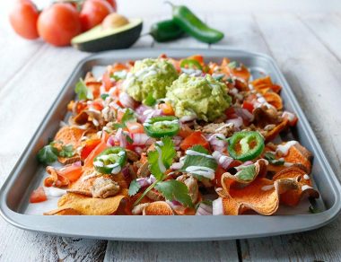 Get your snack on with these sweet potato nachos topped with spicy ground turkey, sliced jalapeños, and swirls of dairy-free sour cream.