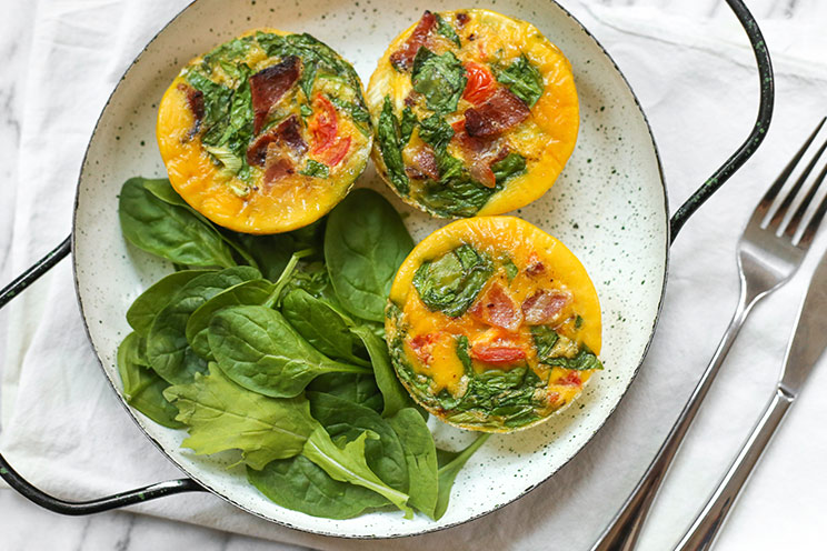 These individual-sized egg muffins are chock full of bacon and spinach for a satisfying, portable breakfast.