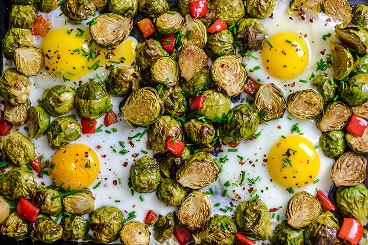 Roast Brussels sprouts, eggs and fresh bell peppers in one tray for an easy breakfast with leftovers to spare.