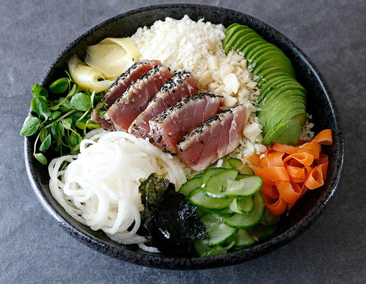 Swap your ho-hum salad for this vibrant bowl filled with fresh veggies and seared sesame tuna. It’s a refreshing, vitamin-packed bowl that satisfies.