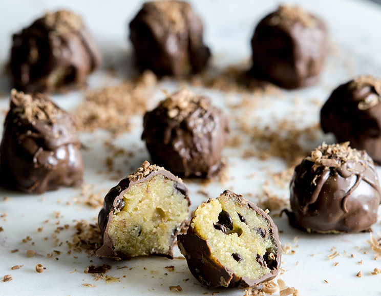 Roll up almond flour cookies and dip ’em in decadent dark chocolate for easy, no-bake truffles.