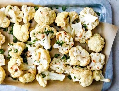 Boost your gut health with this Roasted Garlic Cauliflower, complete with cancer-fighting nutrients. Cauliflower never looked so good.