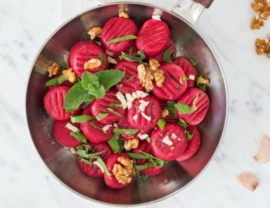 Brighten up your dinner plate with this pillowy Beet Gnocchi topped with walnuts, mint, and fresh lovage.