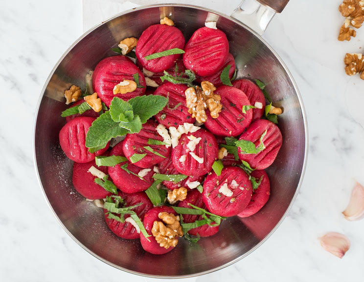 Brighten up your dinner plate with this pillowy Beet Gnocchi topped with walnuts, mint, and fresh lovage.