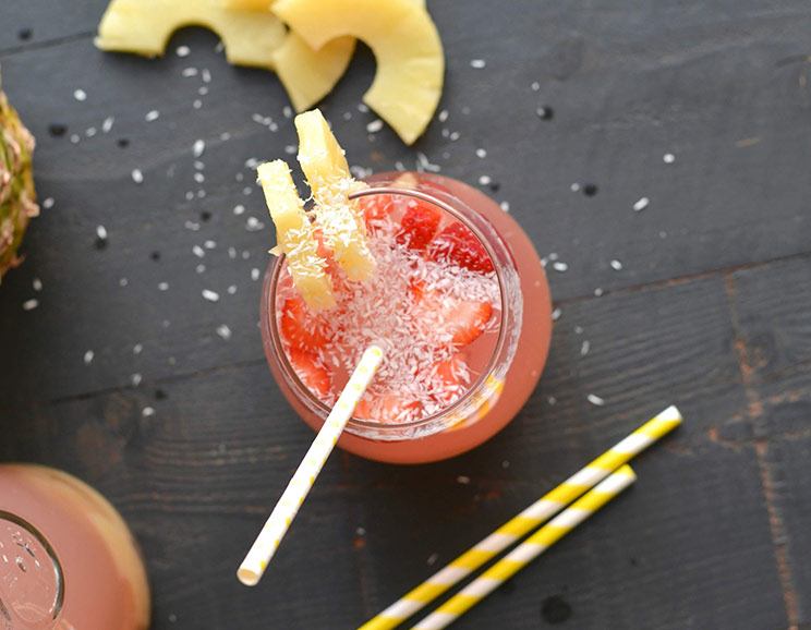 This homemade Piña Colada Sangria combines fresh pineapple juice, coconut water, and a splash of cherry juice for a flavor bursting with tropical flavor.