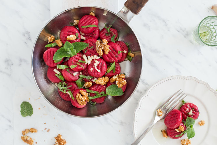 Brighten up your dinner plate with this pillowy Beet Gnocchi topped with walnuts, mint, and fresh lovage.