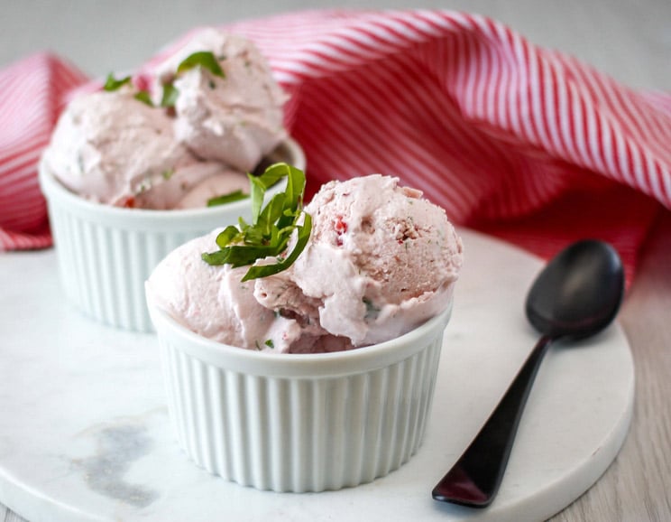 Kick sugar cravings to the curb with this homemade Strawberry and Basil Ice Cream. It's better than anything you'd find at Baskin Robbins.