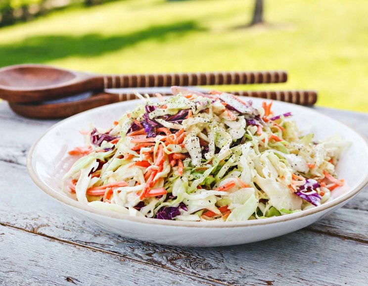 Planning a backyard barbecue? Check out this Paleo Coleslaw made with antioxidant-rich cabbage smothered in creamy honey Dijon dressing.