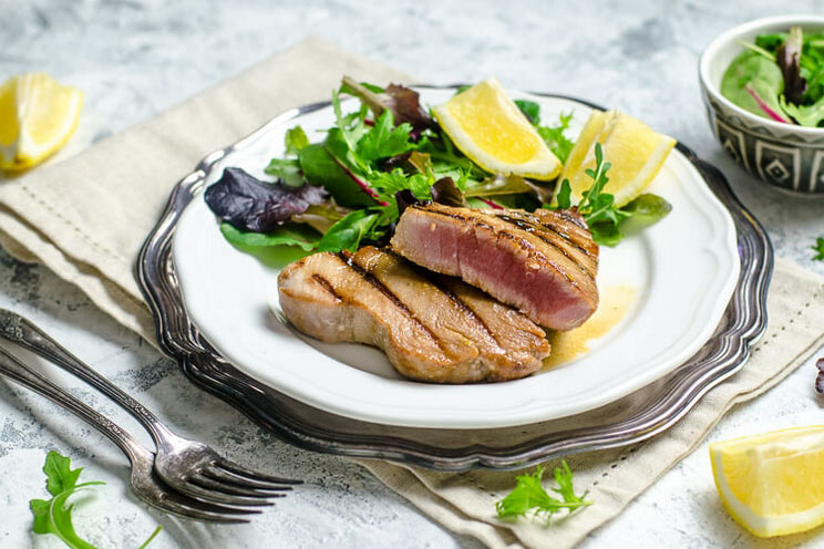 Grilled on the outside and red and juicy on the inside, these maple and mustard-glazed tuna steaks make the perfect simple and elegant dinner for two.