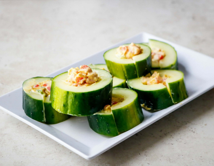 Fill these Stuffed Keto Cucumber Bites with creamy Paleo mayonnaise, peppers, and nutritional yeast. They're simple, nutritious, and oh-so delicious!