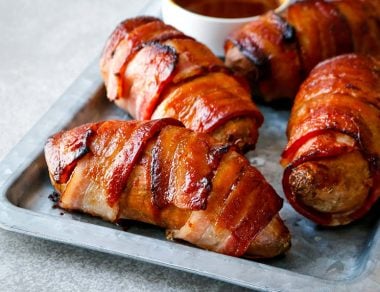 Take a trip to flavortown with these mouthwatering Bacon Wrapped Sweet Potatoes, slathered in a tangy barbecue sauce.