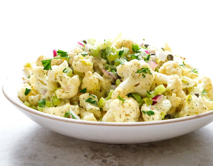 Reduce starches and whip up this Cauliflower Potato Salad as a healthier alternative to the creamy classic you crave. Is there anything cauliflower can't do?