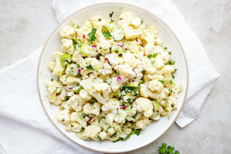 Reduce starches and whip up this Cauliflower Potato Salad as a healthier alternative to the creamy classic you crave. Is there anything cauliflower can't do?