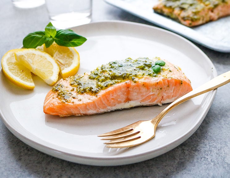 Salmon gets roasted with a sweet garlic-herb coating to achieve crispy skin on the outside and a fork-tender bite on the inside.