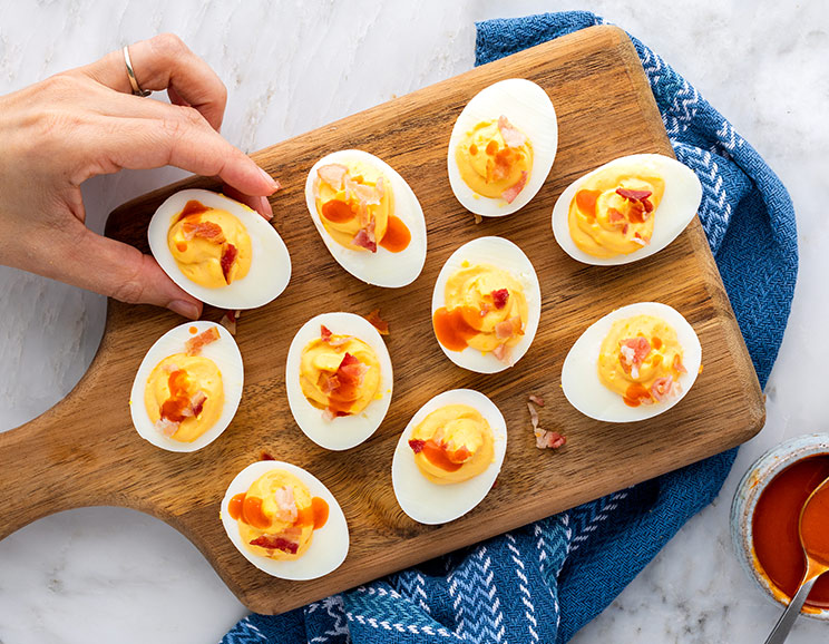 These fiery Buffalo Bacon Deviled Eggs take the traditional recipe up a notch. They're drizzled with extra buffalo sauce and topped with crumbled bacon!