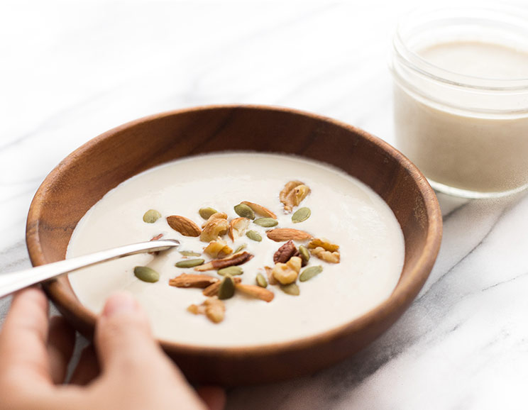 Blend cashews with honey, vanilla and probiotics and ferment overnight for a tangy, creamy, homemade cashew yogurt.