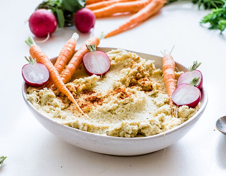 This is quick, delicious and creamy cauliflower dip is great for sliced veggies and homemade chicken fingers. Top with olive oil and a sprinkle of paprika!