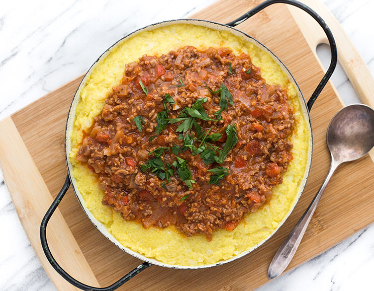 Settle in and serve up a warm bowl of creamy Cauliflower Polenta with Bolognese. This dish hits the soul and we're here for it!