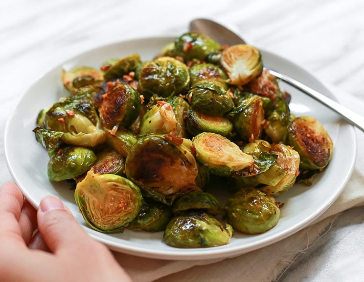Roasted with a dash of balsamic vinegar, these crispy Brussels sprouts are bursting with sweet caramelized flavor.