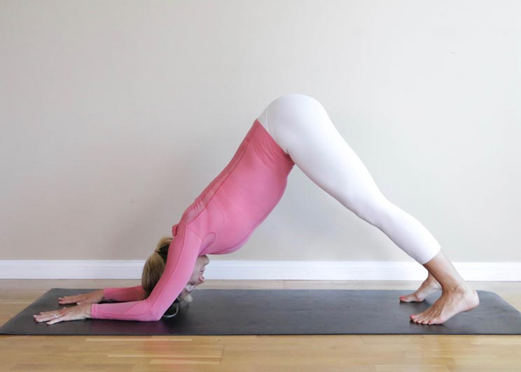 7 Yoga Inversions to Boost Blood Flow + Metabolism