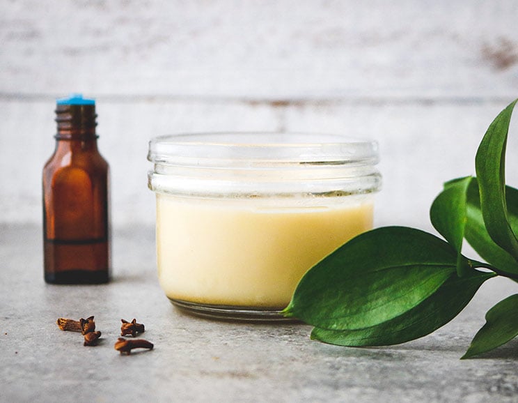 Soothe achy muscles with a homemade salve that helps manage pain with natural oils and herbs. Massage away the pain with icy-hot stimulation!