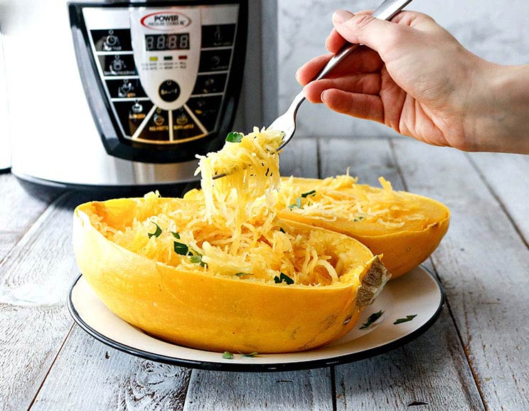 Set your timer! This Instant Pot recipe cooks up an entire spaghetti squash to tender perfection in just 15 minutes.