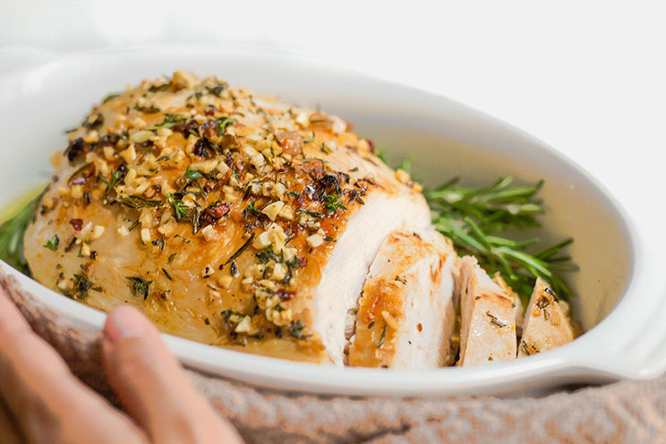 Say goodbye to dried out turkey breast because this herb-roasted recipe locks in all the drippings. We're salivating just looking at these photos!
