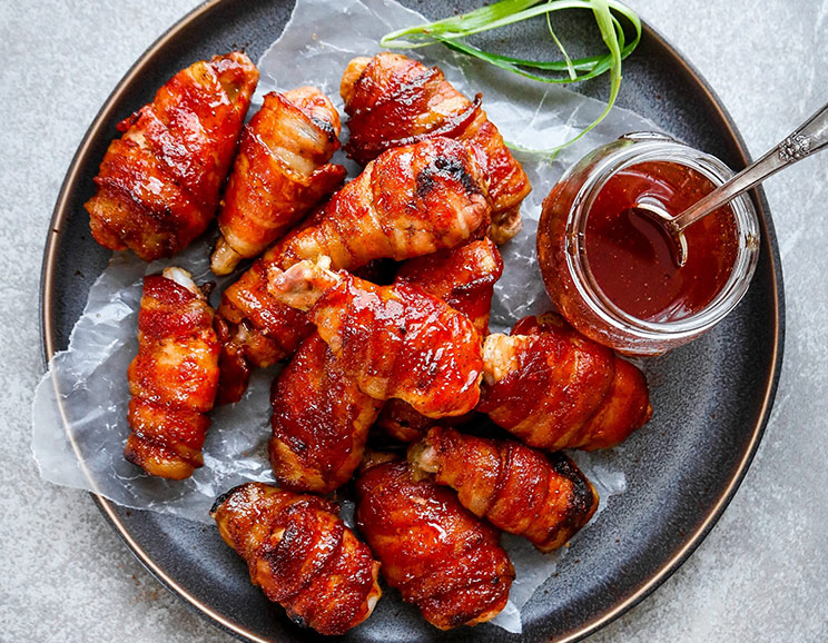 Make these irresistible Maple Bacon Wings for the ultimate game day appetizer - no frying necessary. Smokey, sweet, and finger lickin' good!