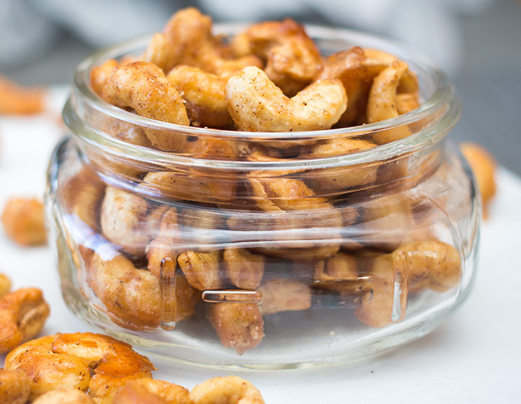 Calm your rumbling tummy with a batch of sweet and salty cashews roasted in a maple cinnamon glaze.