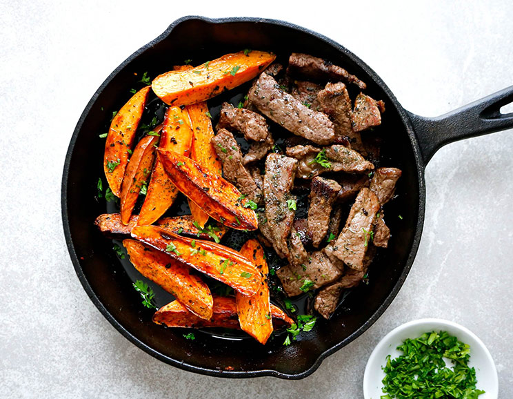Make dinner a breeze with this one-pan Steak and Sweet Potato Fries smothered in buttery ghee and herbs.