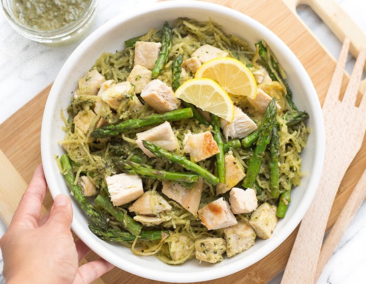 Say hello to thin spaghetti squash noodles flavored in homemade pesto and mixed with sautéed chicken and asparagus.