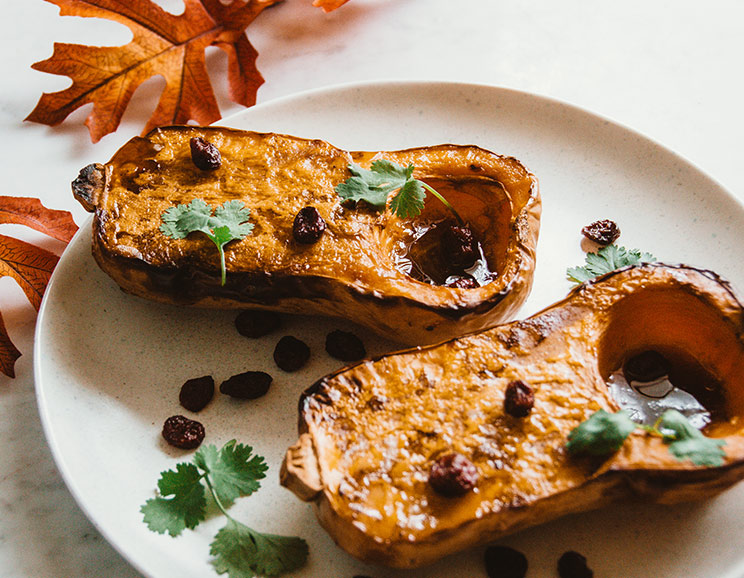 Roast up this honeynut squash for a simple side dish featuring sweet maple, cinnamon, and juicy cranberries.