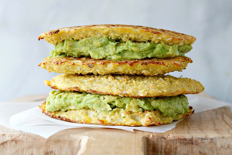 Grilled cheese gets a decadent makeover with creamy, mashed avocado sandwiched between crispy, gluten-free cauliflower bread.