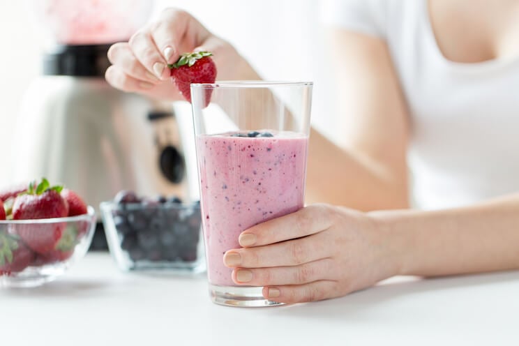 Woman making a healthy protein shake