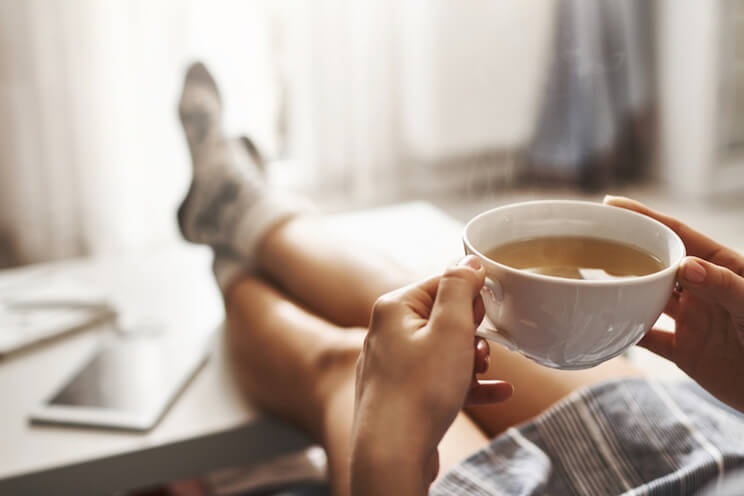 woman relaxing and drinking tea