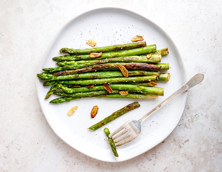 Step aside steamed vegetables, this one-pan asparagus recipe shines with buttery ghee and crispy garlic shavings!