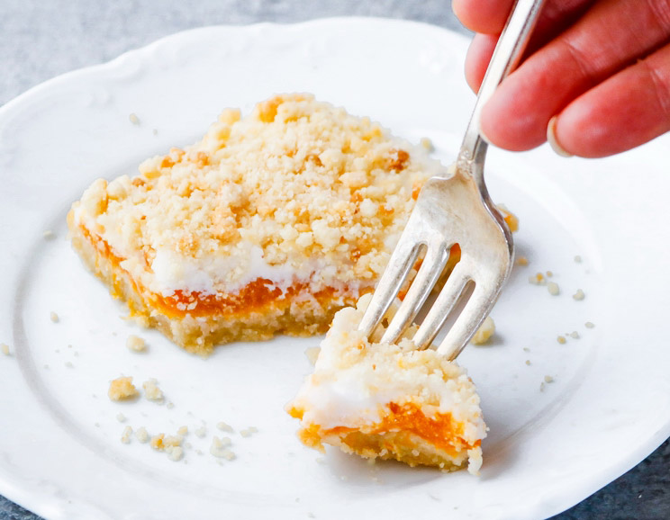 Whip up these keto-friendly crumb bars packed with coconut cream, apricot filling, and a crunchy crumble on top.